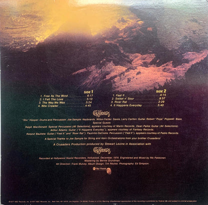 The Crusaders : Free As The Wind (LP, Album, RE, Glo)