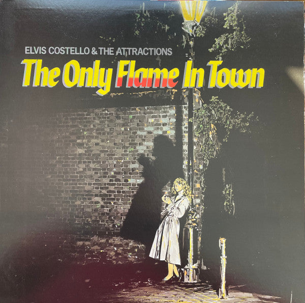 Elvis Costello & The Attractions : The Only Flame In Town (12", Single, Pit)